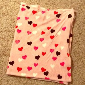 Heart-shaped fleece blanket currently folded.